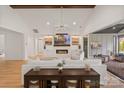 Spacious living room featuring vaulted ceiling, fireplace, and access to outdoor patio at 16112 Terry Ln, Huntersville, NC 28078