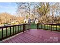 Inviting back deck with wood railing, perfect for outdoor relaxation and enjoying views of the surrounding landscape at 1919 Windlock Dr, Charlotte, NC 28270