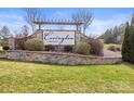 Stone sign for Covington at Lake Norman, surrounded by lush greenery and landscaping at 2479 Seagull Dr, Denver, NC 28037