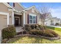 Home exterior with well-maintained landscaping, charming details, and a welcoming entryway at 2479 Seagull Dr, Denver, NC 28037