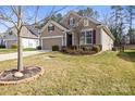 Well-maintained home with a two-car garage, neat landscaping, and attractive exterior at 2479 Seagull Dr, Denver, NC 28037