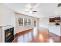 Spacious living room with fireplace, hardwood floors, and plenty of natural light at 2679 Southern Trace Dr, Waxhaw, NC 28173