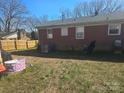 Image of a backyard with some junk, but also plenty of backyard at 307 Bright Ave, Bessemer City, NC 28016