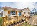 Inviting single-story home featuring a spacious wooden porch perfect for relaxation at 307 Walnut St, Clover, SC 29710