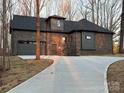 Stunning brick home featuring a concrete driveway and two-car garage, perfect for modern living at 3738 Glen Arbor Dr, Maiden, NC 28650