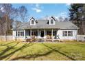 Picturesque home with a charming front porch, perfect for enjoying the outdoors and creating a welcoming entrance at 400 Joe Cloninger Rd, Bessemer City, NC 28016