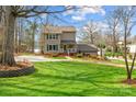 Charming home features a spacious lawn and lush landscaping at 520 Mainsail Rd, Salisbury, NC 28146