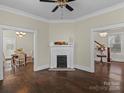 Spacious living room with hardwood floors, fireplace, and open doorways to other rooms at 629 S Fulton St, Salisbury, NC 28144