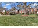 Exterior shot of house showing yard and brick facade at 7214 Quail Meadow Ln, Charlotte, NC 28210