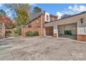 Brick home exterior featuring a private driveway and a two-car garage at 7214 Quail Meadow Ln, Charlotte, NC 28210