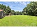 Backyard featuring a very spacious and well-maintained lawn at 9808 Washam Potts Rd, Cornelius, NC 28031
