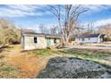 An inviting bungalow with a covered front porch and a spacious yard at 1061 Gaither Nw Pl, Concord, NC 28027