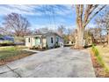 Charming home with a well-maintained yard and a spacious concrete driveway at 1061 Gaither Nw Pl, Concord, NC 28027