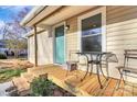 Welcoming front porch with outdoor seating and manicured landscaping details at 1061 Gaither Nw Pl, Concord, NC 28027