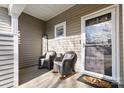 Inviting front porch featuring cozy rocking chairs and a welcoming entrance at 11141 Lions Mane St, Charlotte, NC 28273