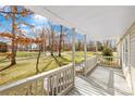 Inviting covered front porch with white railings, offering a relaxing outdoor space at 120 Roger Dr, Statesville, NC 28625