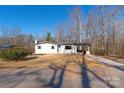 Well-kept single-story home featuring a covered carport, set on a clear lot at 1324 Southampton St, Shelby, NC 28152