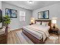 Staged bedroom with a comfortable bed, stylish decor, and soft lighting for a relaxing ambiance at 14106 Ridgewater Way, Charlotte, NC 28278