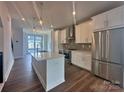 Modern kitchen features stainless steel appliances, a center island, and ample counter space at 2035 Clarksdale Dr # 33, Charlotte, NC 28206