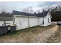 Side exterior of home with vinyl siding and view of the outdoor space at 2414 Lane St, Kannapolis, NC 28083