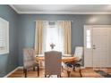 Cozy dining area with hardwood floors, neutral paint, and natural light at 2864 Sweeping Pine Ln, Denver, NC 28037