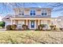 Inviting home exterior showcasing the porch with white railings and colorful landscaping at 3008 Semmes Ln, Indian Trail, NC 28079