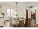 Dining room with hardwood floors, large windows, and a decorative chandelier at 314 Royal Crescent Ln, Waxhaw, NC 28173