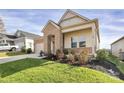Landscaped front yard with colorful shrubs complements this home's brick and siding exterior at 3532 Tully Ave, Kannapolis, NC 28081
