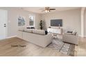 Inviting living room with modern furniture, neutral colors, and ample natural light for comfortable living at 417 Columbus Ln, Monroe, NC 28110