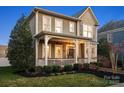 Beautiful home exterior with a cozy front porch and well-maintained landscaping at 519 Fourth Baxter Xing, Fort Mill, SC 29708