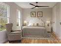 Cozy bedroom featuring a ceiling fan, plush furniture, and natural light from a window at 546 Beatties Ford Rd, Charlotte, NC 28216