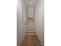 A bright white staircase with wood treads leads to the upper level of the home at 546 Beatties Ford Rd, Charlotte, NC 28216