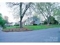 Lovely two-story home with a well-kept lawn and a charming gazebo at 5925 Carmel Station Ave, Charlotte, NC 28226