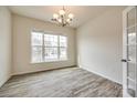Bright dining room featuring wood-look flooring and natural light from large windows at 844 Braddock Way, Fort Mill, SC 29715