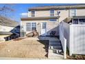 Private backyard with a patio, well-maintained fence, and access to parking at 9741 Turning Wheel Dr, Charlotte, NC 28214