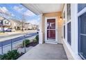 Cozy front porch featuring a storm door, vinyl siding, and neighborhood views at 9741 Turning Wheel Dr, Charlotte, NC 28214