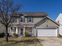 Inviting two-story home with a well-kept lawn, complemented by a classic design and ample parking at 12915 Deaton Hill Dr, Charlotte, NC 28269