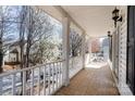 View from the home's second story porch that features white railings and neutral colored tile at 13014 Windy Lea Ln, Huntersville, NC 28078