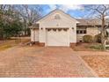 Spacious single-car garage with a brick-paved driveway for easy access at 136 Coble Ave, Albemarle, NC 28001