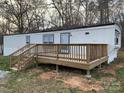 Close-up exterior view of a single-story home with a wood deck at 150 Twisted Oak Ln, Gastonia, NC 28052