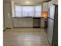 Bright kitchen with stainless steel appliances, granite counters, and ample storage space at 150 Twisted Oak Ln, Gastonia, NC 28052
