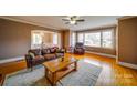 Inviting living room featuring hardwood floors, large windows, and comfortable seating, perfect for relaxing or entertaining at 204 Julia Ave, Belmont, NC 28012