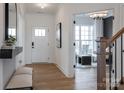 Bright entryway featuring a white door, wood floors, stylish decor, and an inviting view into the office at 3523 Rapport Ct # 026, Lancaster, SC 29720