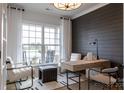 Sunlit home office with neutral palette, featuring a window view, desk, and comfortable seating at 3523 Rapport Ct # 026, Lancaster, SC 29720