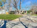 Well-maintained home featuring a long driveway, attractive landscaping, and a classic design at 4201 Winedale Ln, Charlotte, NC 28205