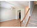 Spacious living area featuring wood floors, a ceiling fan, and a staircase at 530 Pate Dr, Fort Mill, SC 29715