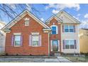 Charming brick and vinyl two-story home with colorful shutters and well-maintained landscaping at 558 Rough Hewn Ln, Rock Hill, SC 29730