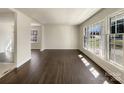Spacious living room with hardwood floors and natural light from the windows at 5901 Craftsbury Dr, Charlotte, NC 28215