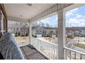 Balcony with view of neighboring homes, features a white railing and wooden deck at 6211 Canyon Trl, Denver, NC 28037