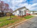 Cozy home with a fenced yard, showcasing its neat exterior and neighborhood charm at 719 Washington St, Cramerton, NC 28032
